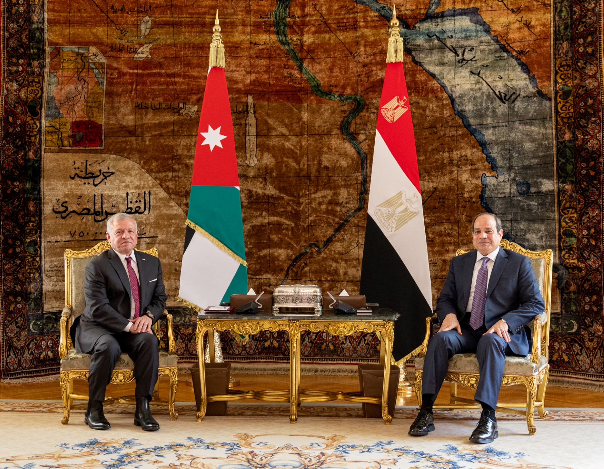 A handout picture released by the Jordanian Royal Palace shows Jordan's King Abdullah II (L) and Egypt's President Abdel Fattah al-Sisi during a meeting in Cairo on December 27, 2023. (AFP)
