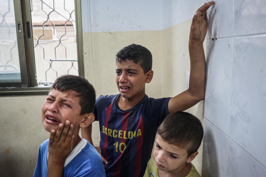 Palestinian youths mourn relatives killed in Israeli strikes on the Bureij refugee camp, at the al-Awda Hospital at the Nuseirat refugee Camp in the central Gaza Strip amid the ongoing conflict between Israel and the Palestinian Hamas militant group. (File/AFP)