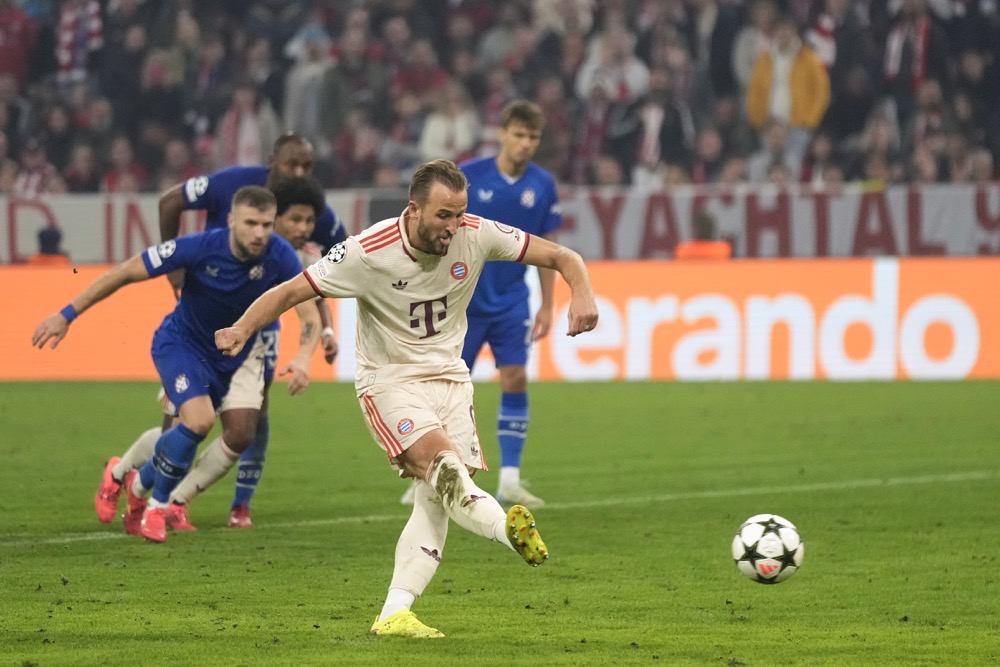 Bayern's Harry Kane scores his sides 7th goal and his 4th of the game from the penalty spot during the Champions League opening phase soccer match between Bayern Munich and GNK Dinamo at the Allianz Arena in Munich, Germany. (AP)