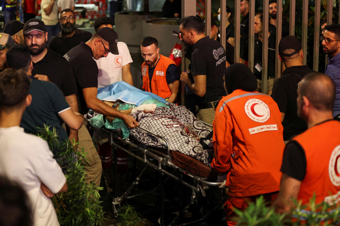 A person is carried on a stretcher outside American University of Beirut Medical Center (AUBMC) as people, including Hezbollah fighters and medics, were wounded and killed when the pagers they use to communicate exploded across Lebanon. (File/Reuters)