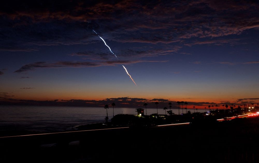 An evening launch of a SpaceX Falcon 9 rocket carrying 20 Starlink V2 Mini satellites is seen over the Pacific Ocean from Encinitas, California, US, June 23, 2024. (Reuters)