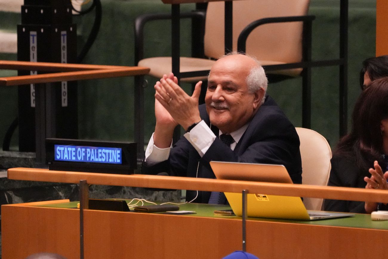 Palestinian representative Riyad Mansour applauds the result of the vote at UN Headquarters on September 18, 2024 in New York. (AFP)