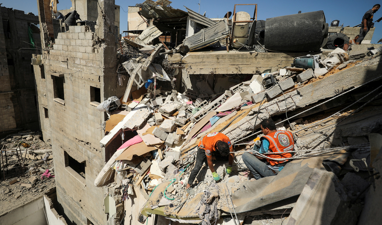 Rescuers work to recover the body of a Palestinian girl from under the rubble of a house hit in an Israeli strike, amid the Israel-Hamas conflict, in Gaza City on September 19, 2024. (REUTERS)