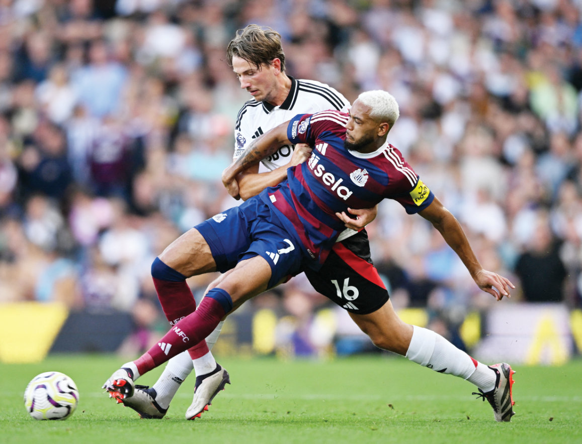 Newcastle United’s Joelinton in action with Fulham’s Sander Berge during Saturday’s Premier League match. (Reuters)