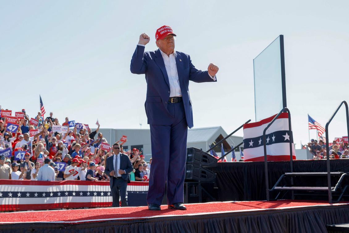 Republican presidential candidate former US President Donald Trump walks offstage after speaking at a campaign rally at the Aero Center Wilmington on September 21, 2024 in Wilmington, North Carolina. (AFP)