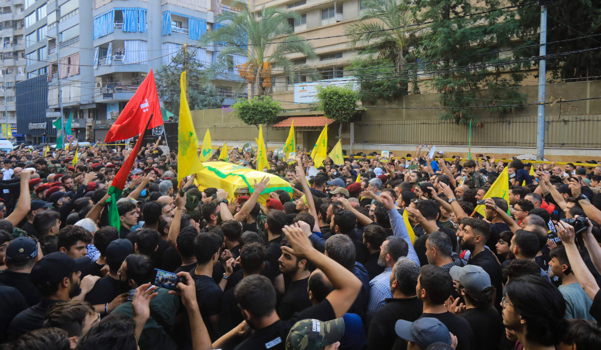 People take part in the funeral procession of Ibrahim Aqil, the head of Hezbollah's elite Radwan Force, in Beirut's southern suburbs on September 22, 2024. (AFP)