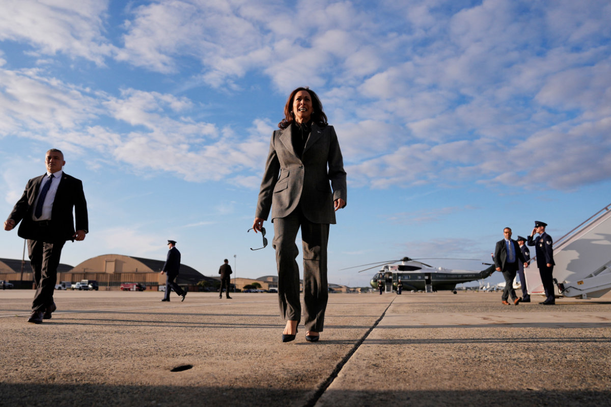 Democratic presidential nominee Vice President Kamala Harris walks over to speak to members of the media upon her arrival at Andrews Air Force Base, Maryland, on September 22, 2024. (Pool via REUTERS)