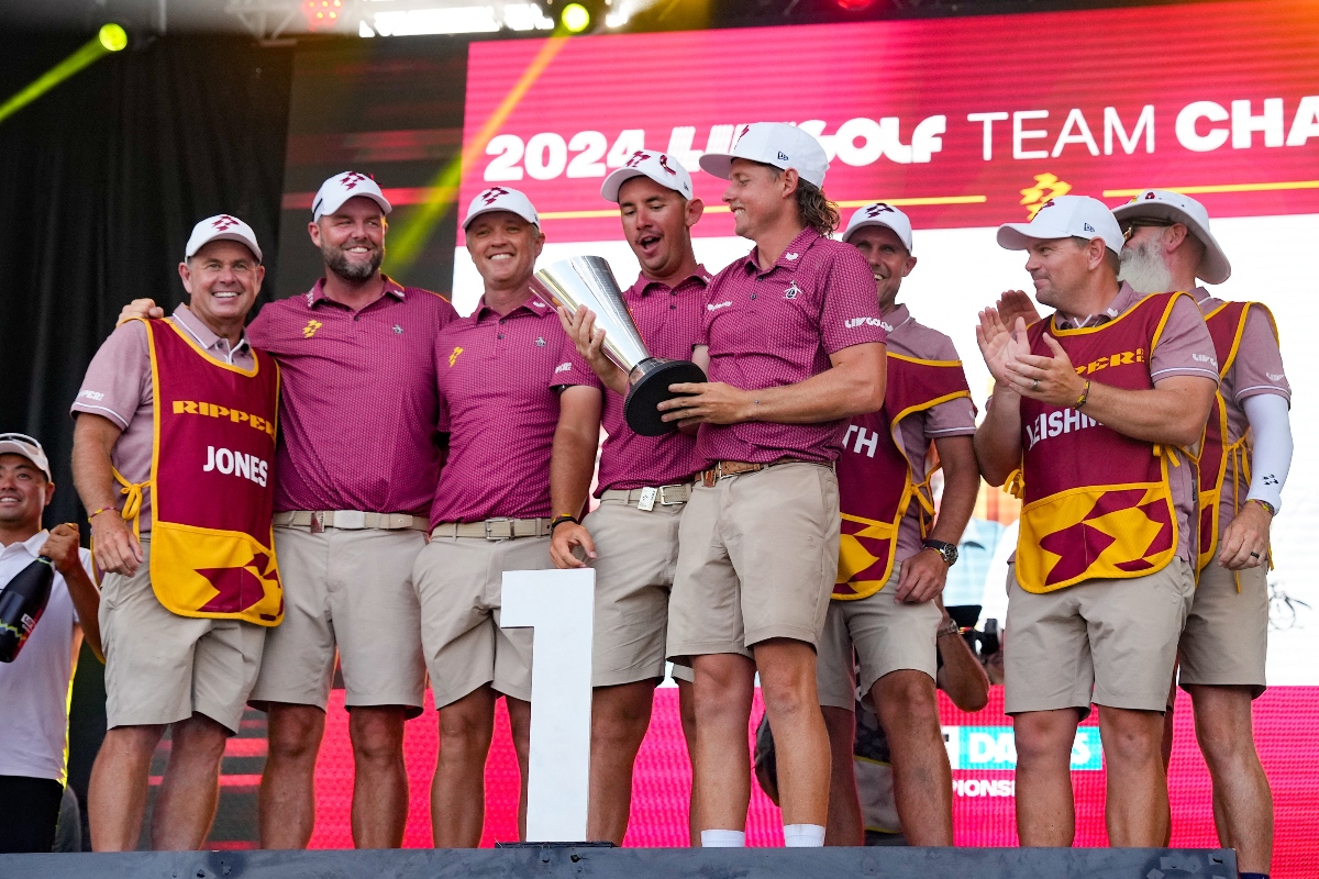 Cameron Smith, captain of Ripper GC, holds the LIV Golf team championship trophy as he celebrates with teammates Marc Leishman, Matt Jones, Lucas Herbert and caddies during the LIV Golf Dallas Team Championship Finals at Maridoe Golf Club. (USA TODAY Sport)