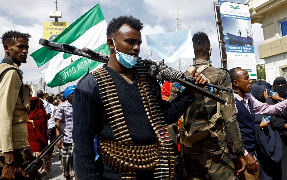 A Somali police officers stands guard during a march against the Ethiopia-Somaliland port deal along KM4 street in Mogadishu, Somalia, Jan. 11, 2024. (Reuters)