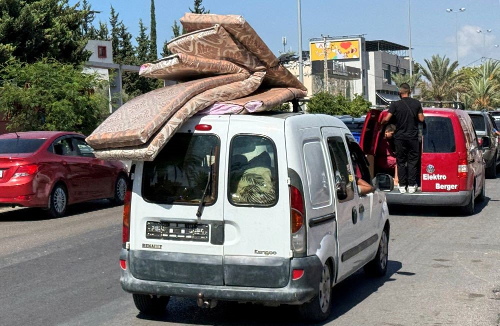 People travel in a vehicle heading north from Lebanon’s southern coastal city of Sidon as some Lebanese flee heavy Israeli bombardment, Lebanon, Sept. 23, 2024. (Reuters)