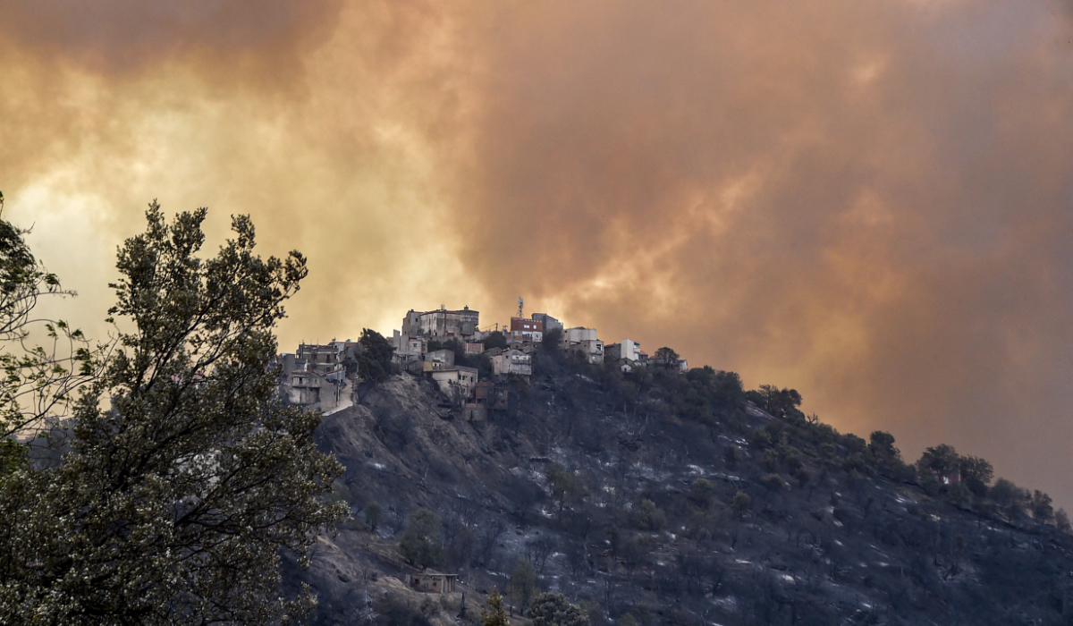 Smoke rises from a wildfire in the forested hills of the Kabylie region, east of the capital Algiers, on August 10, 2021. (AFP)