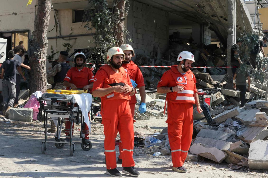 Paramedics arrive at the site of an Israeli strike on the Mount Lebanon village of Maaysra, east of the Christian coastal town of Byblos, on Sept. 25, 2024. (AFP)