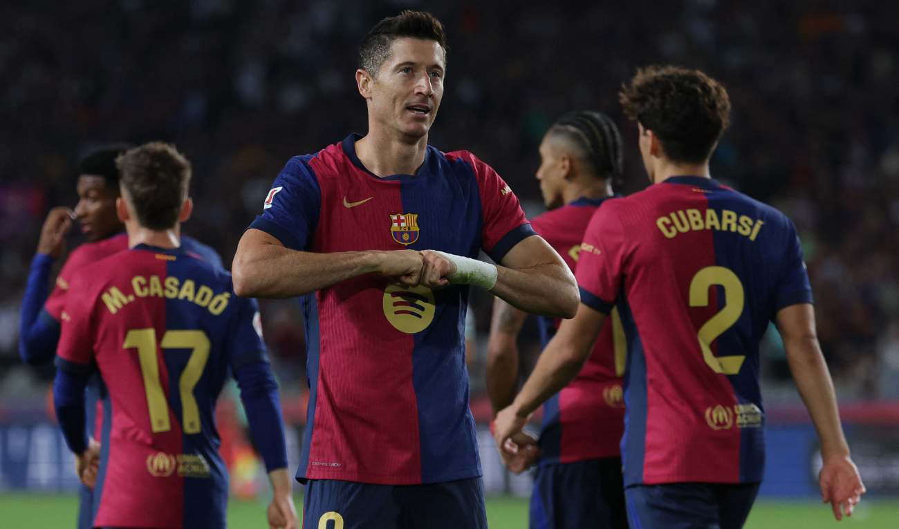 Barcelona's Polish forward #09 Robert Lewandowski celebrates after scoring his team's first goal during the Spanish league football match between FC Barcelona and Getafe CF at the Estadi Olimpic Lluis Companys in Barcelona on September 25, 2024. (AFP)