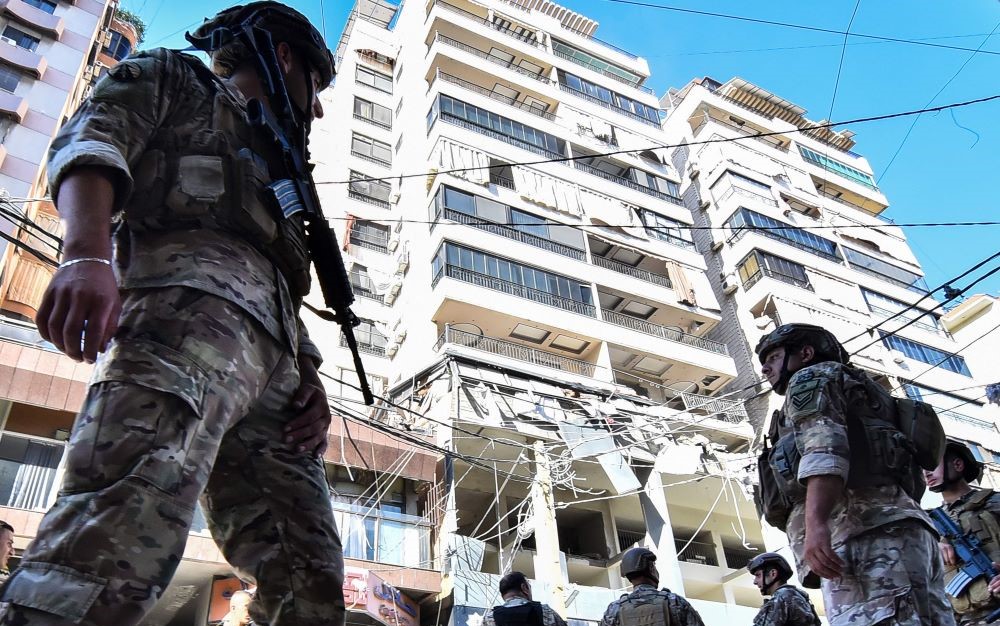 Lebanese army soldiers secure the area of an Israeli airstrike that targeted an apartment on Al-Qaem street in Beirut’s southern suburbs on September 26, 2024. (AFP)