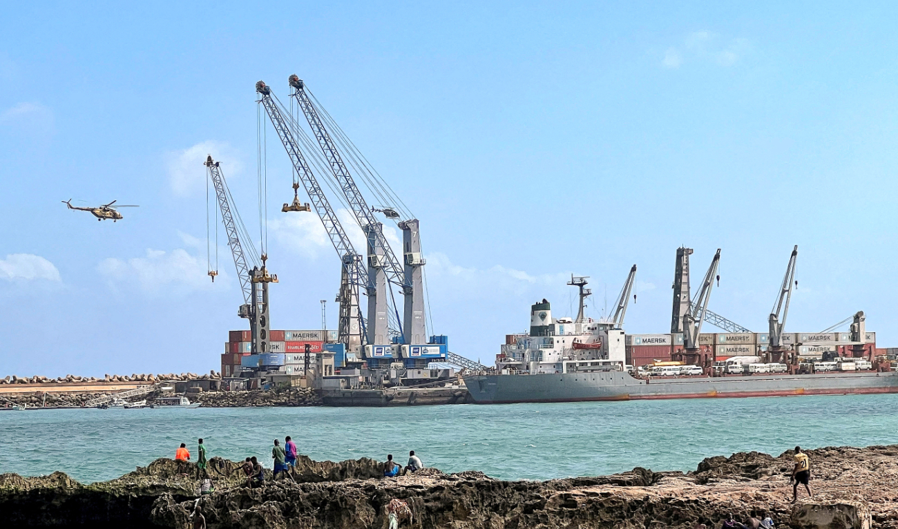 Security helicopters hover above the Mogadishu Sea Port after an Egyptian warship arrived in Somalia to deliver a second major cache of weaponry. (Reuters)