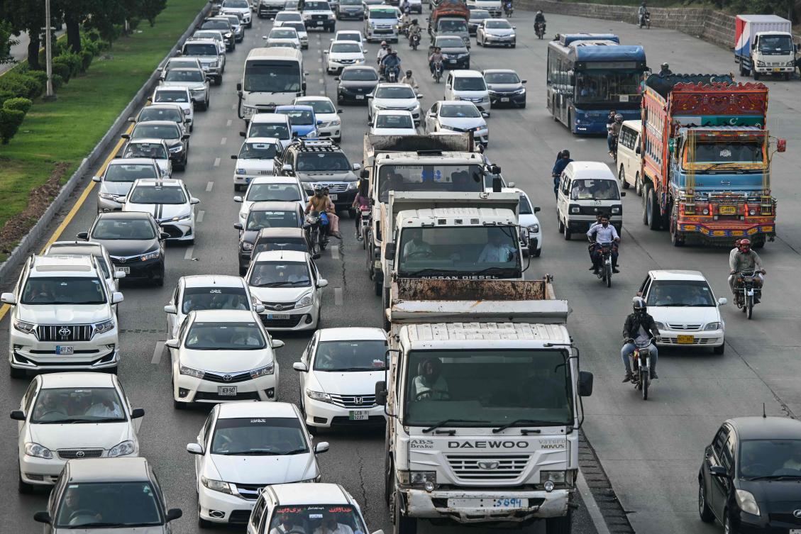 Commuters drive along a highway in Islamabad on September 26, 2024. (AFP)
