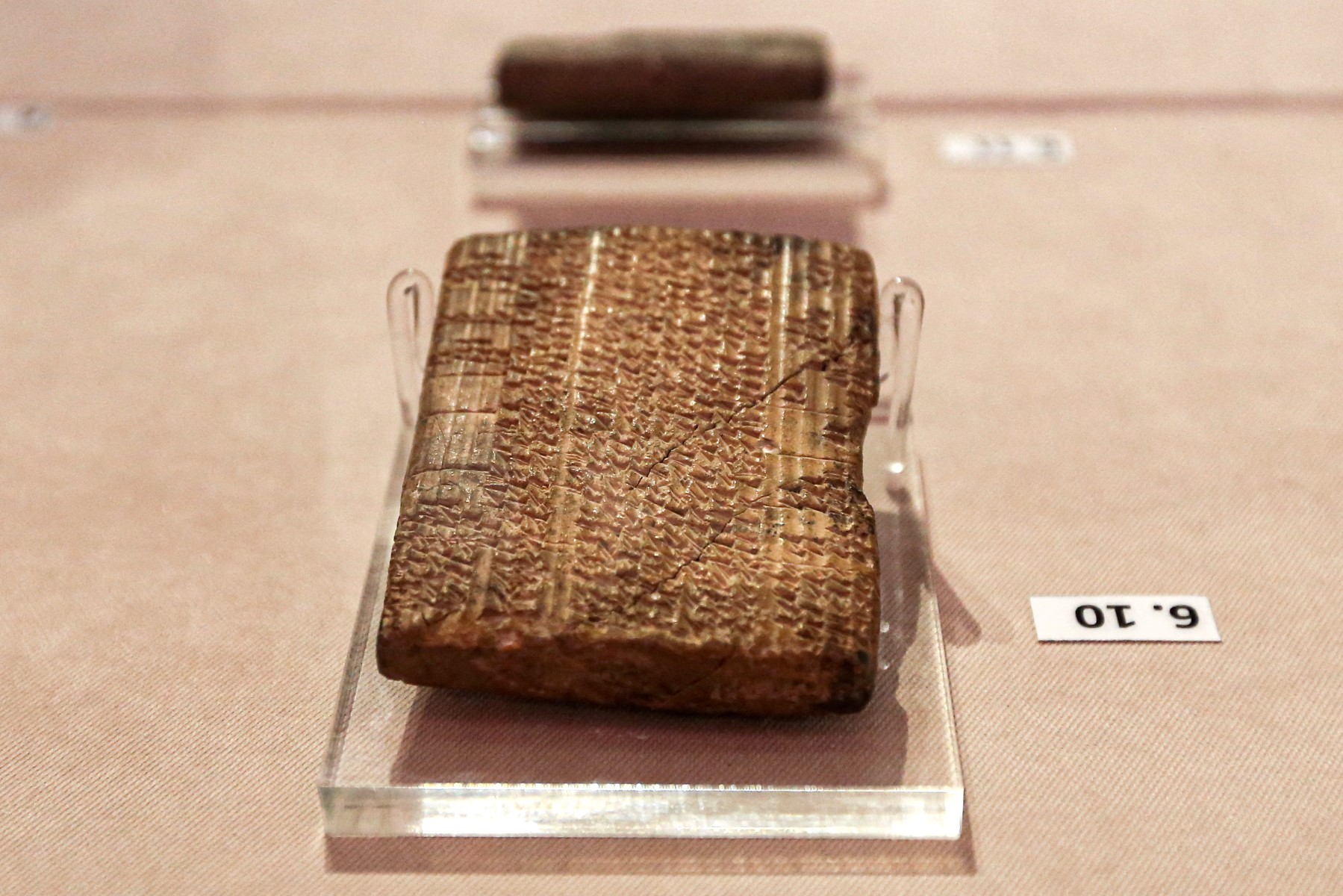 This picture taken on October 2, 2019 shows Achaemenid-era clay tablets on display at Iran's National Museum in the capital Tehran, which were returned by the United States following a US Supreme Court ruling. (AFP)