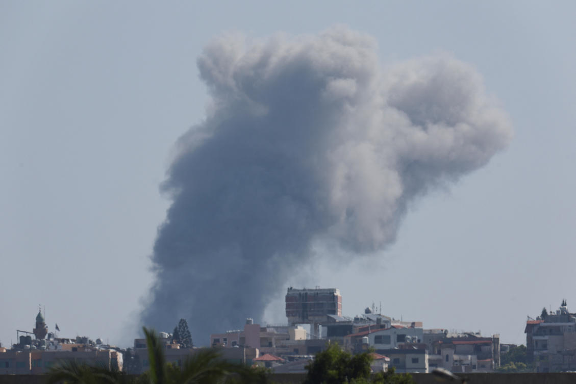 Smoke billows over southern Lebanon following an Israeli strike as seen from Tyre, on Sept. 27, 2024. (Reuters)