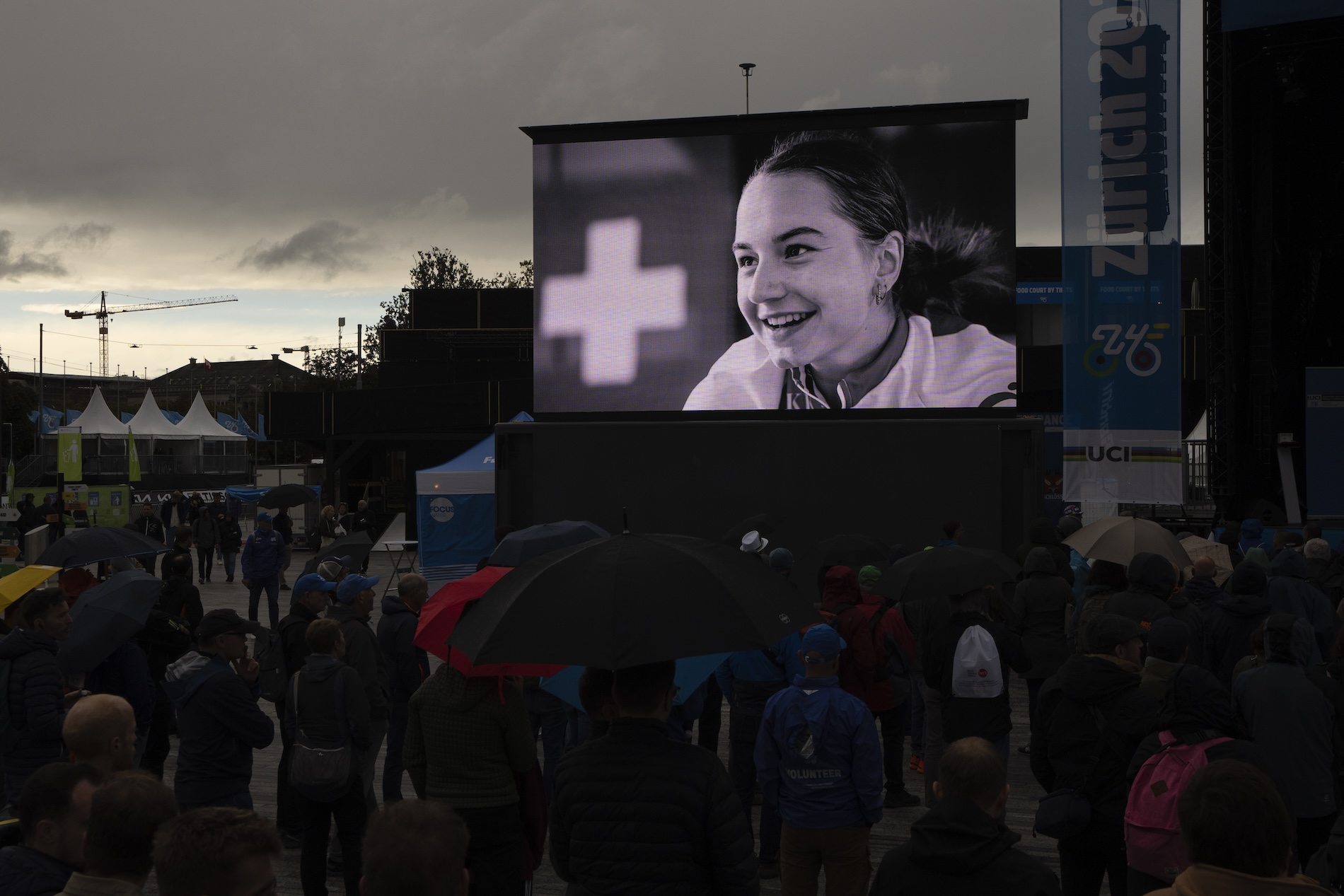 A picture of cyclist Muriel Furrer from Switzerland, who died after a crash Thursday, is projected during a minute of silence prior to the medal ceremony of the Men Under 23 Road Race of the Cycling and Para-cycling Road World Championships in Zurich Friday. (AP)