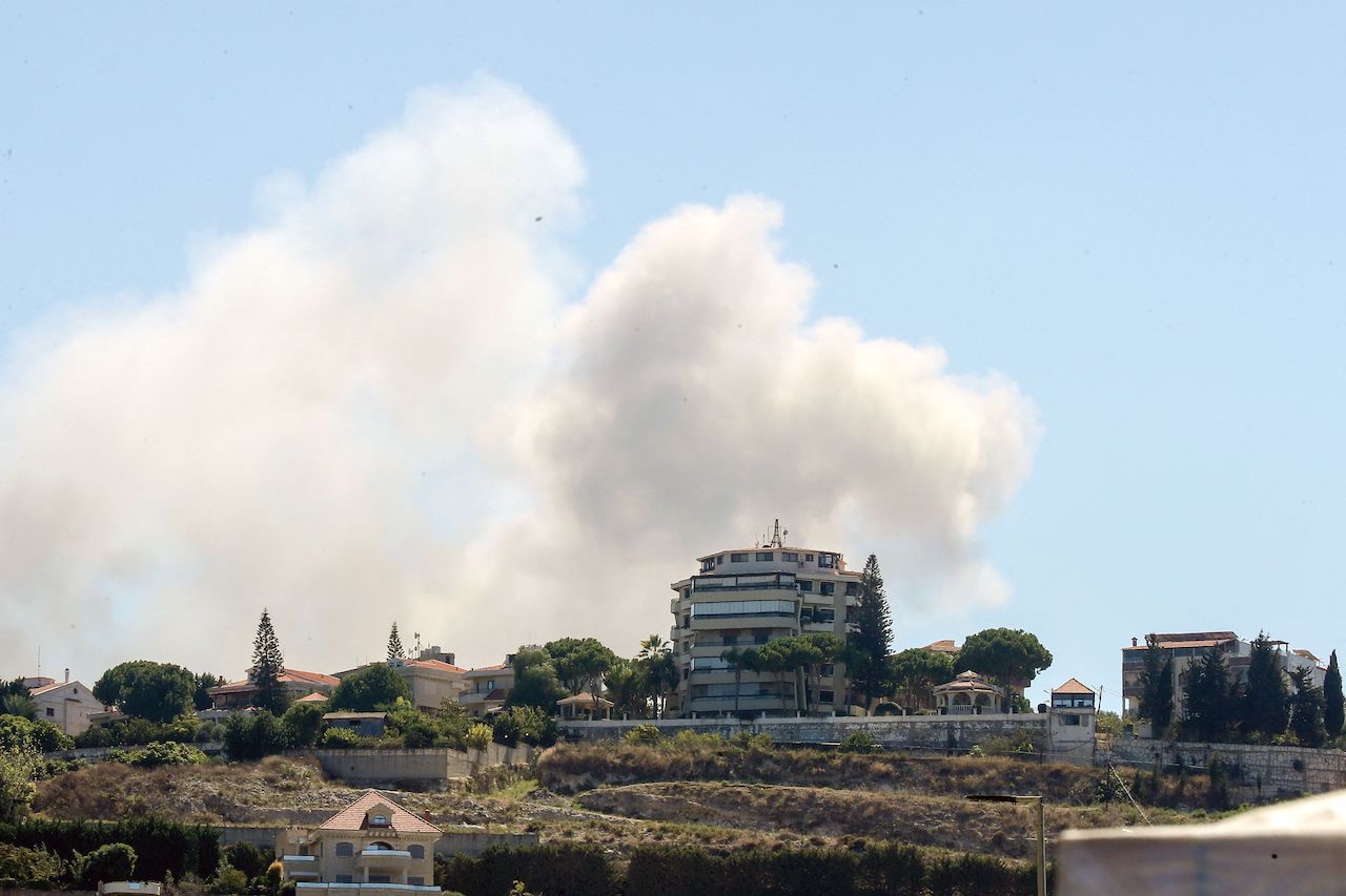 Smoke billows from the site of an Israeli airstrike that targeted the southern Lebanese town of Sarafand, on September 26, 2024. (AFP)