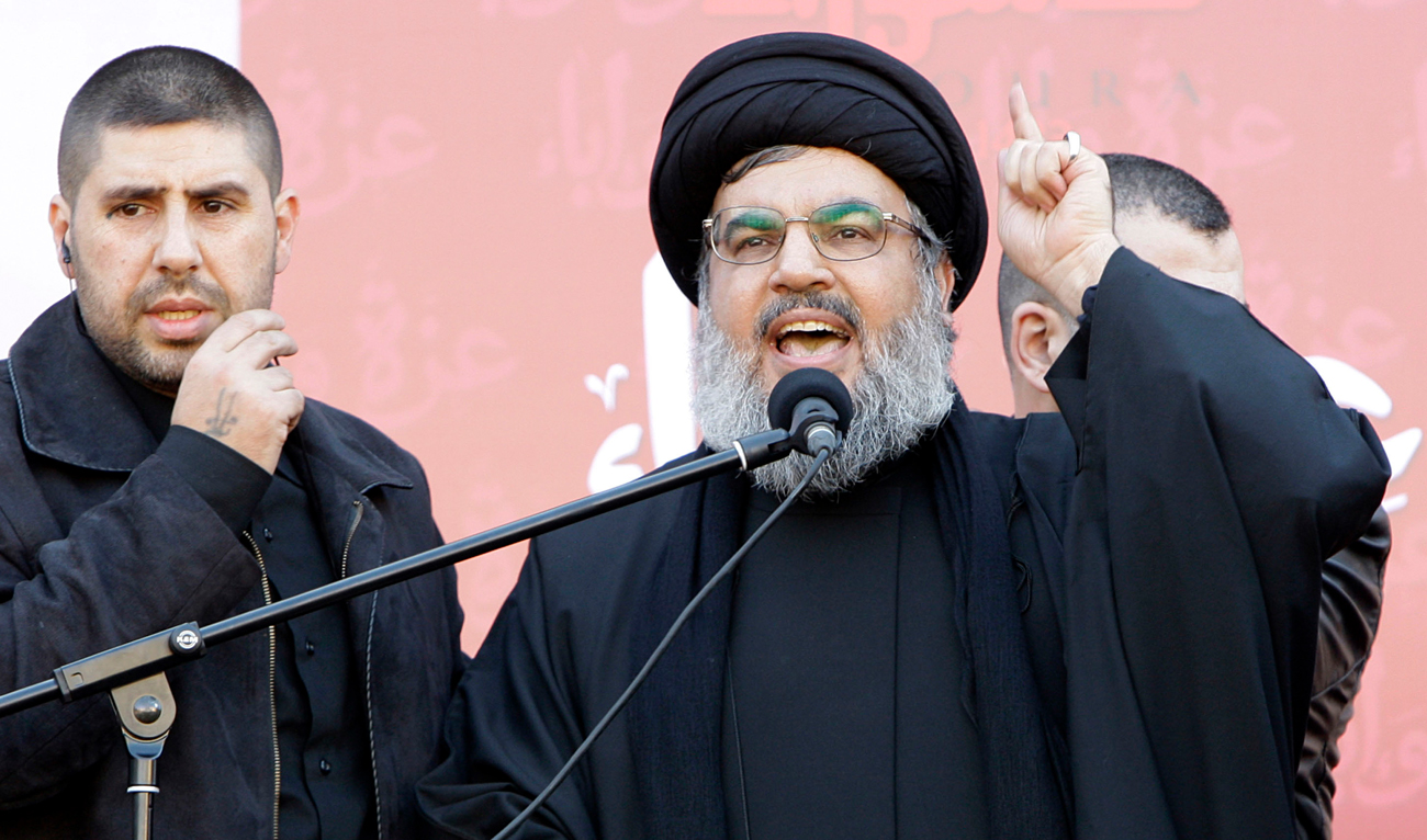 In this file photo, taken on December 6, 2011, Hezbollah leader Hassan Nasrallah speaks to the crowd in a rare public appearance during a rally to mark the Muslim holy day of Ashoura, in Beirut’s southern suburbs. (AP/File)