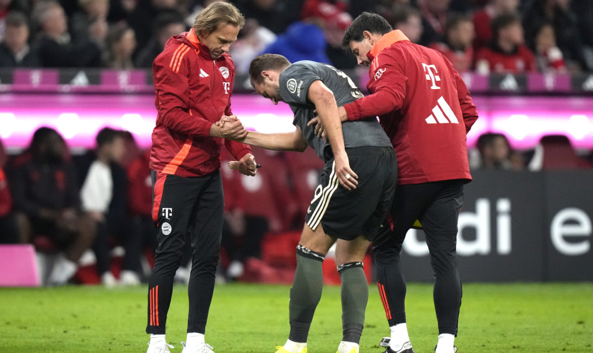 Bayern's Harry Kane leaves the pitch after being injured during the Bundesliga soccer match between Bayern Munich and Leverkusen at the Allianz Arena in Munich Saturday. (AP)
