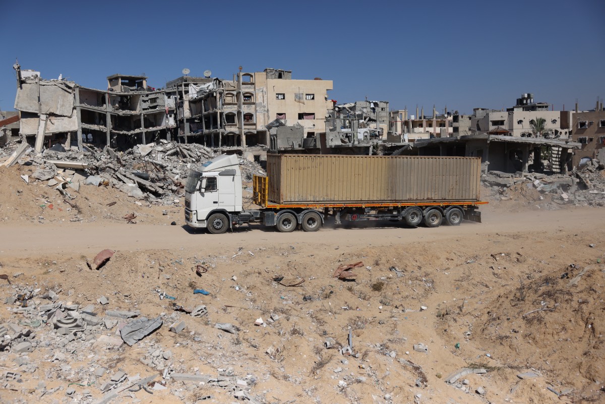 A truck carrying 88 bodies, which according to the Palestinian health ministry entered the Gaza Strip from Israel the day before, as it awaits for the corpses to be unloaded and buried in a mass grave in Khan Yunis on September 26, 2024. (AFP)