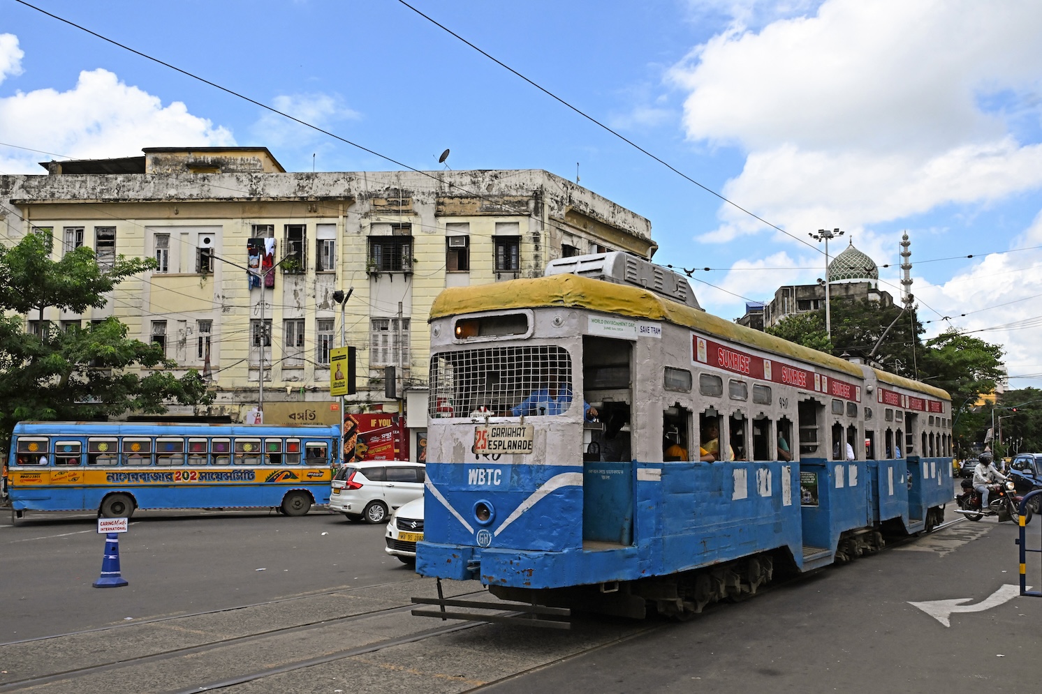 Passengers commute in a tram along a street in Kolkata, India. (File/AFP)