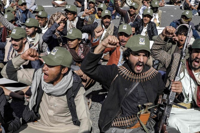 Fighters loyal to Yemen’s Houthi group chant slogans in a military parade marking the anniversary of the Houthis’ 2014 takeover of the capital Sanaa, Sanaa, Sept. 21, 2024. (AFP)