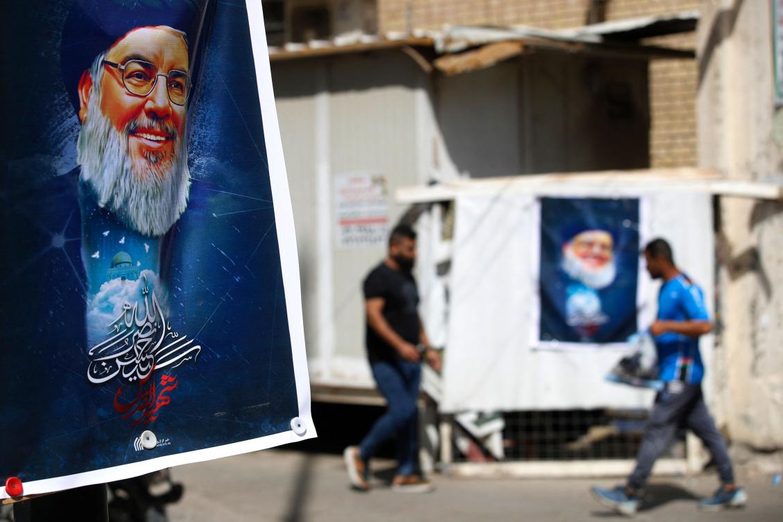 A portrait of Hezbollah's leader Hassan Nasrallah hangs on a street in Baghdad on September 29, 2024. (AFP)