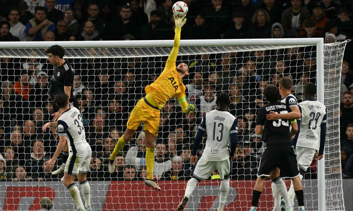 Tottenham Hotspur's Italian goalkeeper #01 Guglielmo Vicario jumps to makes a save during the UEFA Europa League League stage football match between Tottenham Hotspur and at the Tottenham Hotspur Stadium in London, on September 26, 2024. (AFP)