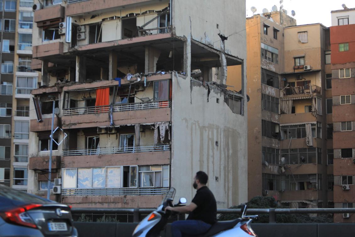 Apartment building that was hit by an Israeli air strike in Beirut’s Cola district on September 30, 2024. Israel hit a Beirut apartment block on September 30, killing three members of a Palestinian armed group in its first strike on the city center since the outbreak of the Gaza war last year. (AFP)