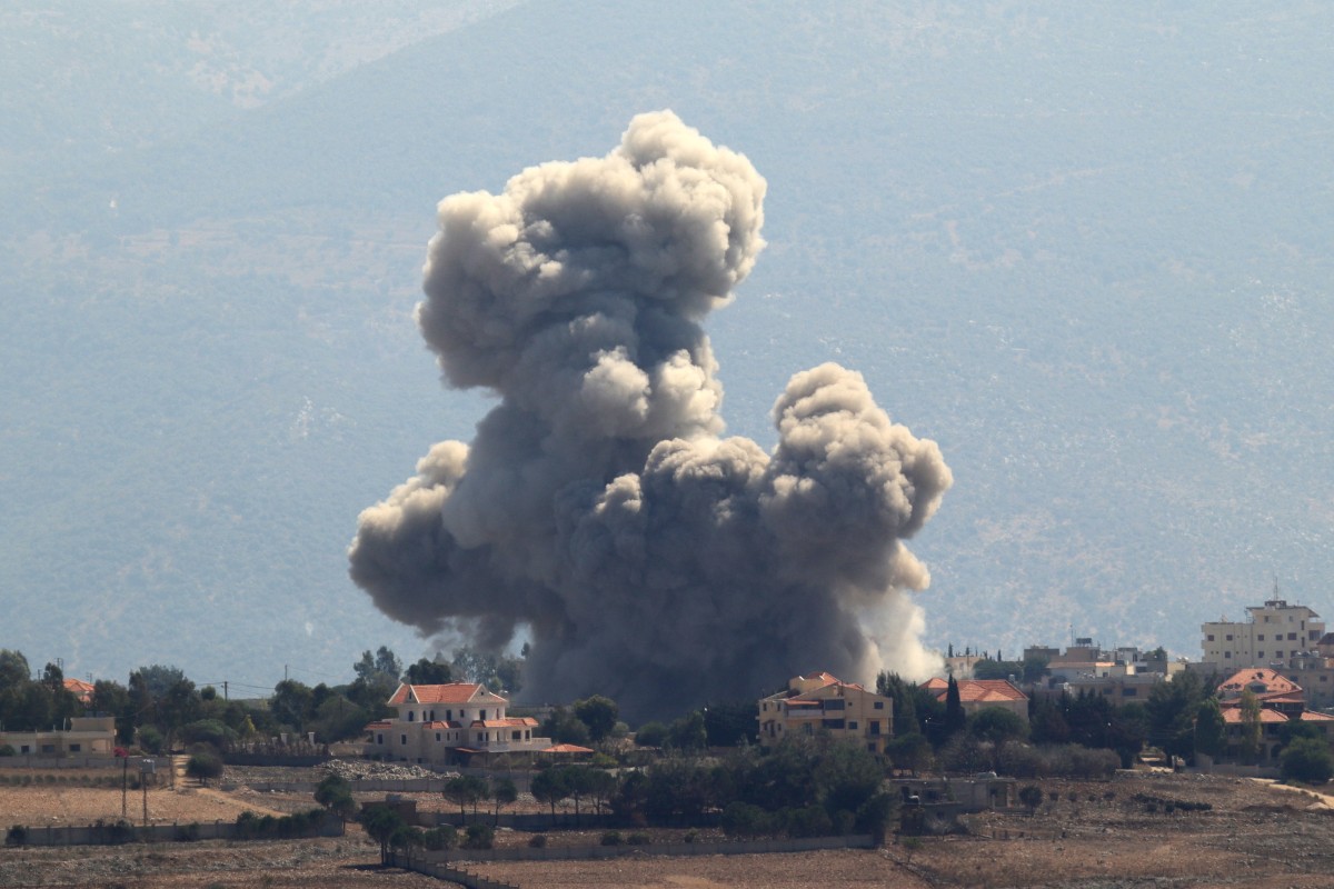 Smoke rises from the site of an Israeli airstrike that targeted the southern Lebanese village of Khiam on September 30, 2024.(AFP)