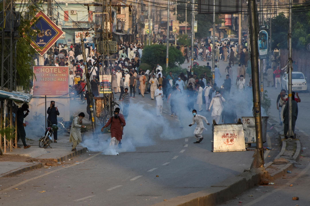 Supporters of Imran Khan’s party, the Pakistan Tehreek-e-Insaf (PTI), gather for a rally as tear gas is used by police officers to disperse them, in Rawalpindi, Pakistan, Sept. 28, 2024. (Reuters)