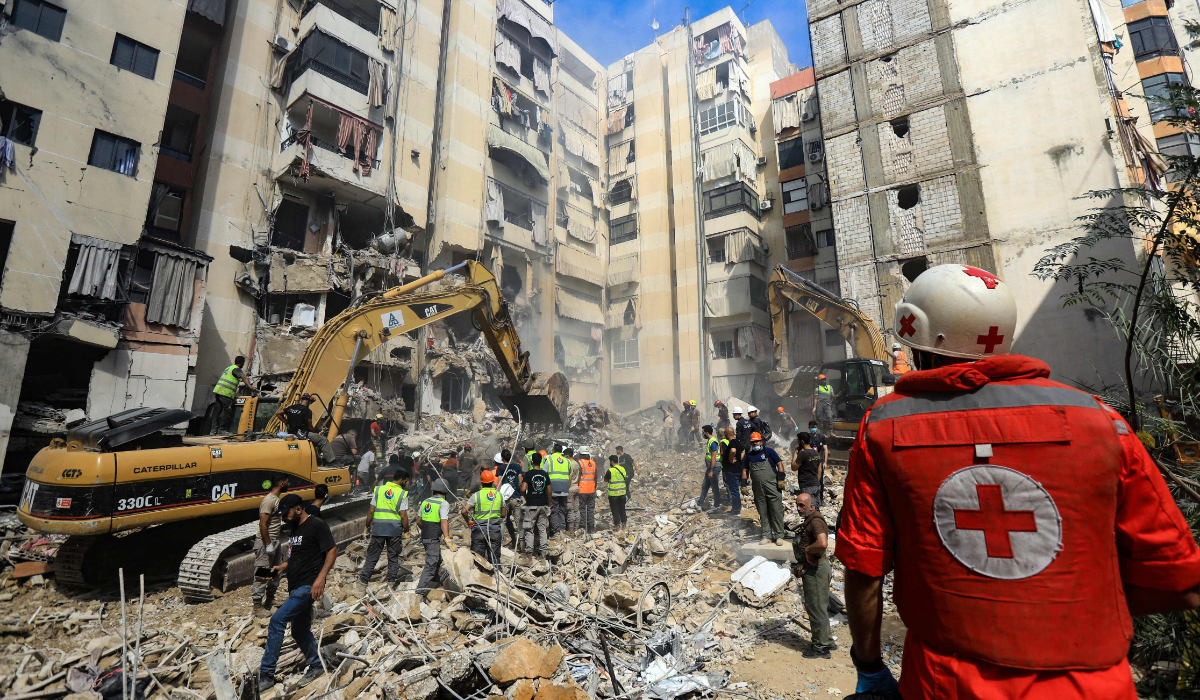 Rescuers sift through the rubble at the scene of an Israeli strike that targeted Beirut's southern suburbs. (AFP)