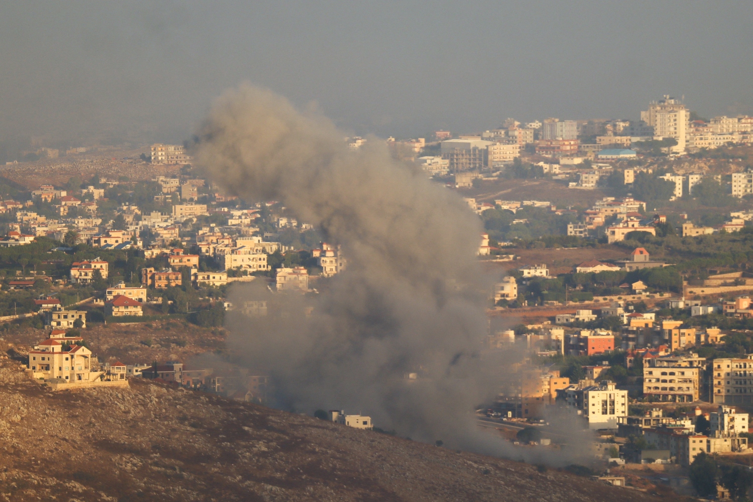 Smoke billows from the site of an Israeli airstrike on the outskirts of the southern village of Habbouch, Lebanon. Sept. 23(AFP)