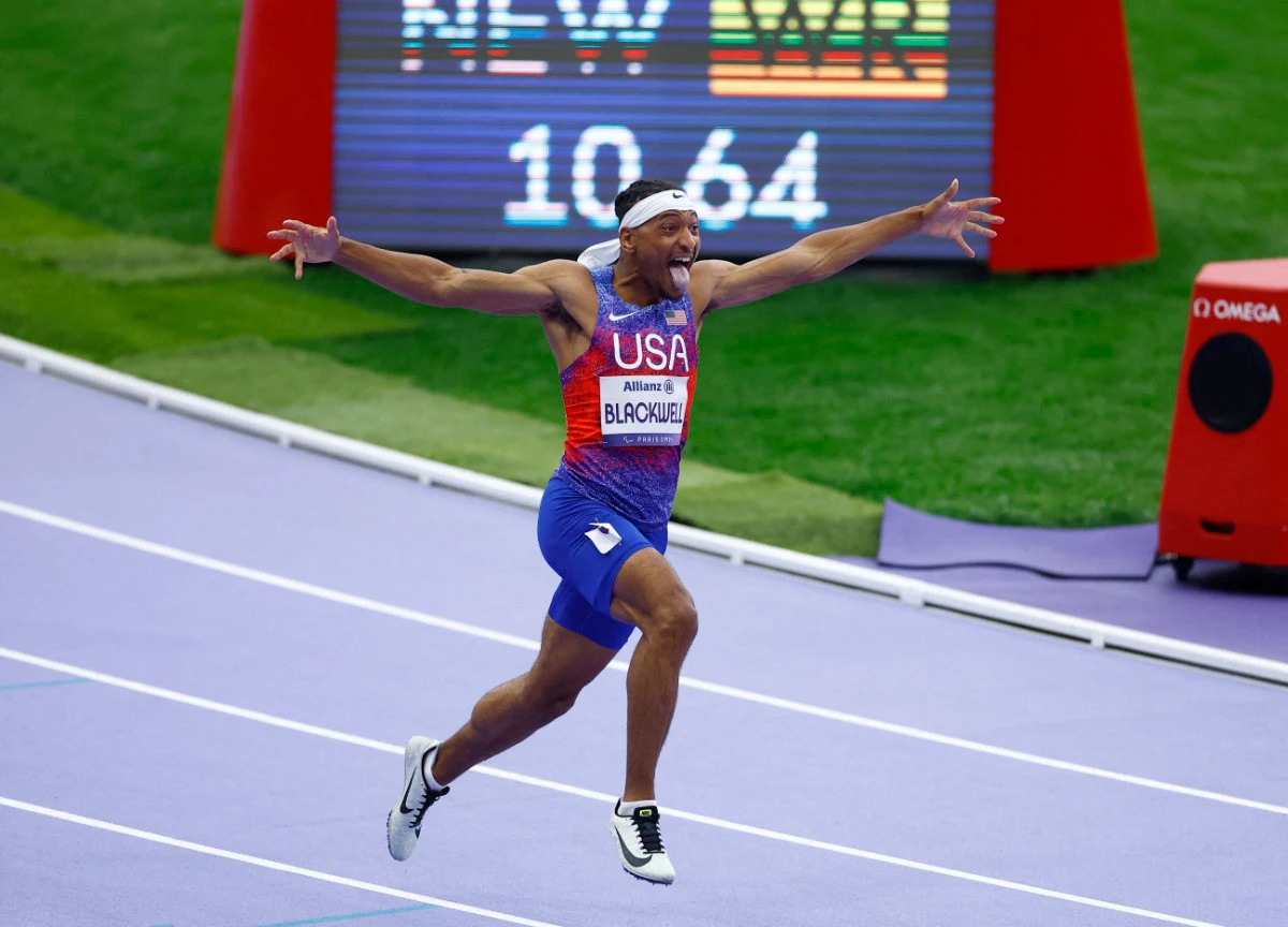 Jaydin Blackwell of United States celebrates after setting a new world record to win gold in the men’s 100m T38 final of athletics competition at the Paris 2024 Paralympics Saturday . (Reuters)