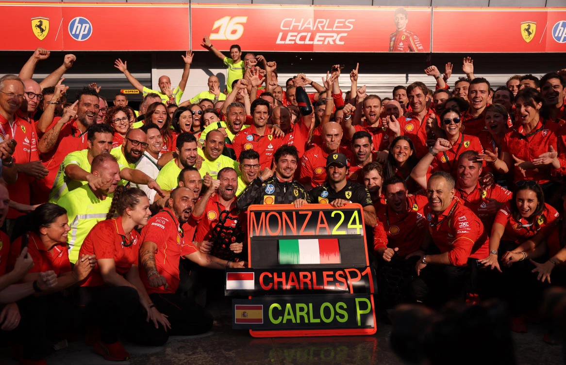Ferrari’s Charles Leclerc celebrates with his team after winning the Italian Grand Prix. (Reuters)