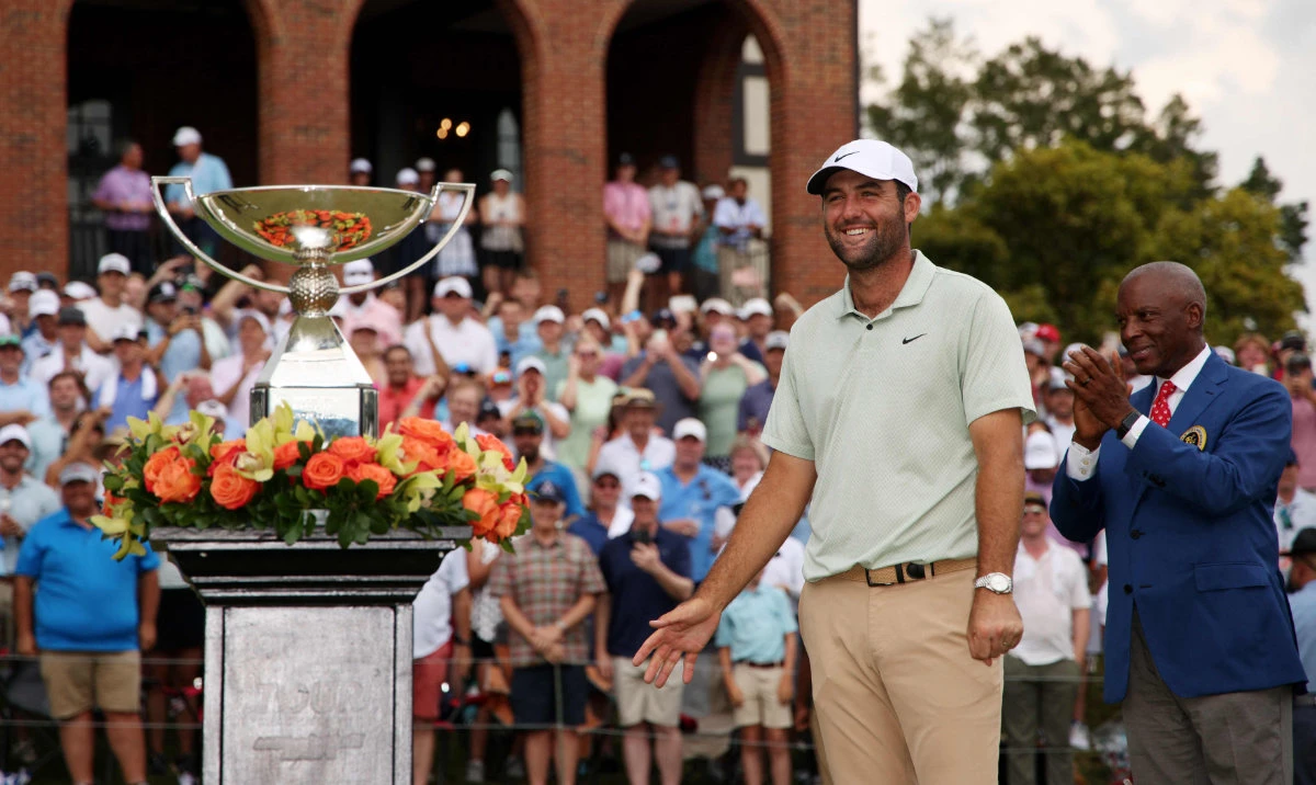Scottie Scheffler of the United States celebrates with the FedExCup Trophy after winning the FedExCup and TOUR Championship at East Lake Golf Club on September 01, 2024 in Atlanta, Georgia. (AFP)