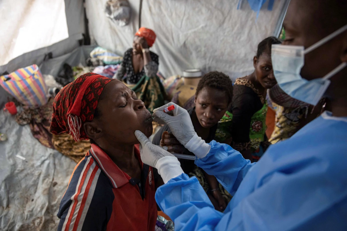 A Congolese nurse takes a sample from Nsimire Nakaziba, a suspected case of mpox in the treatment centre at the Kavumu hospital in Kabare territory. (Reuters)
