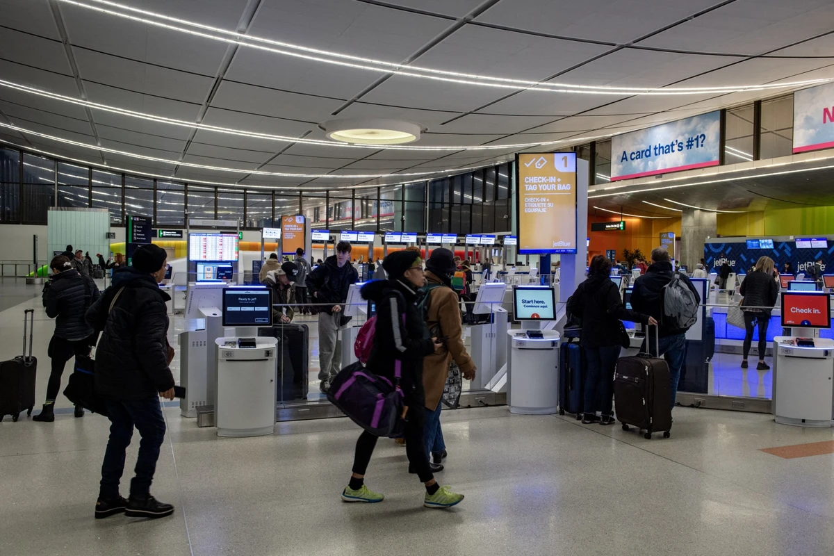 People check into their flights at Boston Logan Airport in Boston. (File photo: AFP)