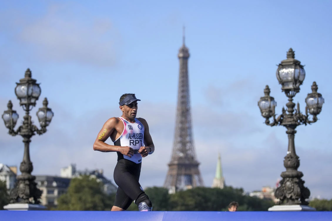 Ibrahim Al Hussein of the Refugees' Paralympic Team competes in the men's PTS3 Triathlon at the 2024 Paralympics in Paris, France. (AP)