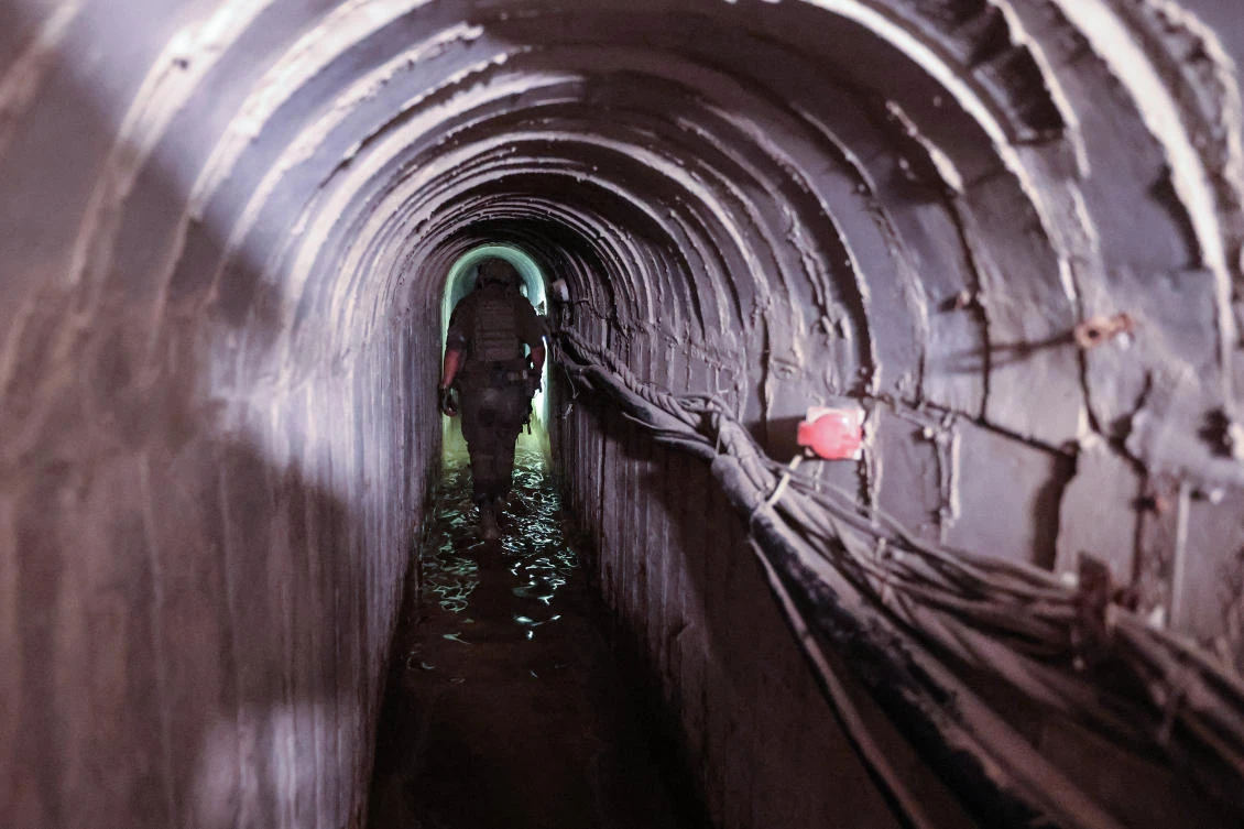 An Israeli soldier is seen inside a tunnel that the army claimed is a “Hamas command tunnel” in Gaza City. (File/AFP)