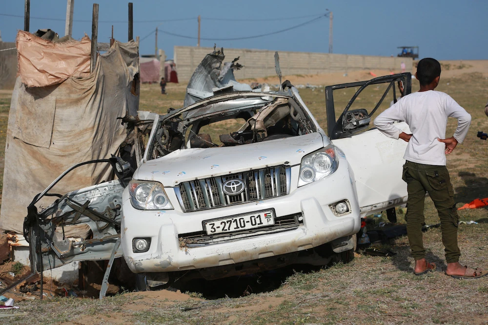 Above, the mangled remains of a car used by World Central Kitchen that was hit by an Israeli strike the previous day in Deir Al-Balah in the central Gaza Strip on April 2, 2024. (AFP)