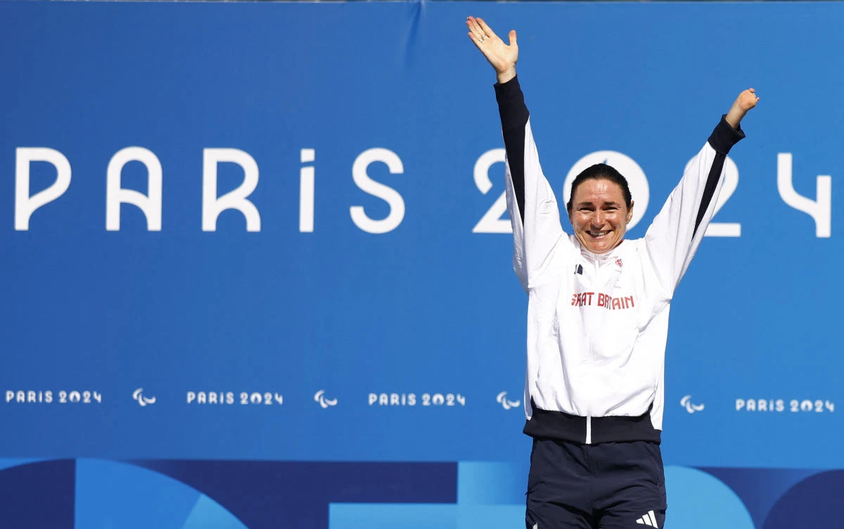 Sarah Storey of Britain celebrates on the podium after winning the gold medal at Paris 2024 Paralympics — Road Cycling — Women’s C4-5 Road Race — Victory Ceremony — Clichy-sous-Bois, France — on Sept. 6, 2024. (Reuters)