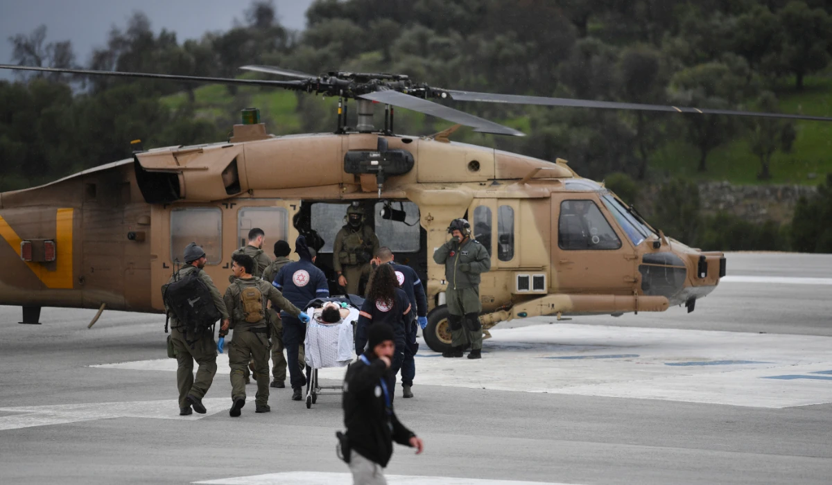 An Israeli medical team evacuate a person injured by a rocket fired from Lebanon, at Ziv hospital in Safed, northern Israel, Wednesday, Feb. 14, 2024. (AFP)