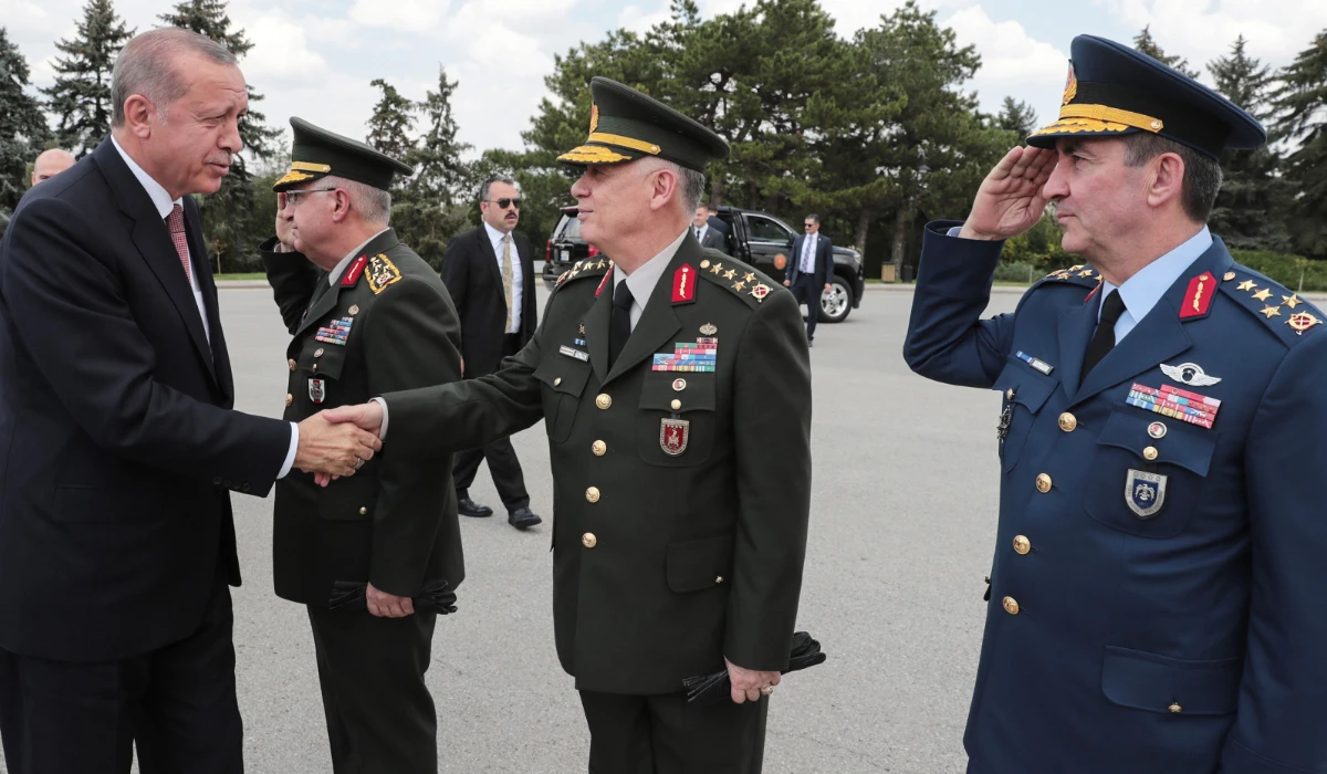 Turkish President Recep Tayyip Erdogan (L) shaking hands with members of the Supreme Military Council during a visit of Anitkabir, the mausoleum of Mustafa Kemal Ataturk, founder of modern Turkey before their meeting in Ankara. (AFP file photo)