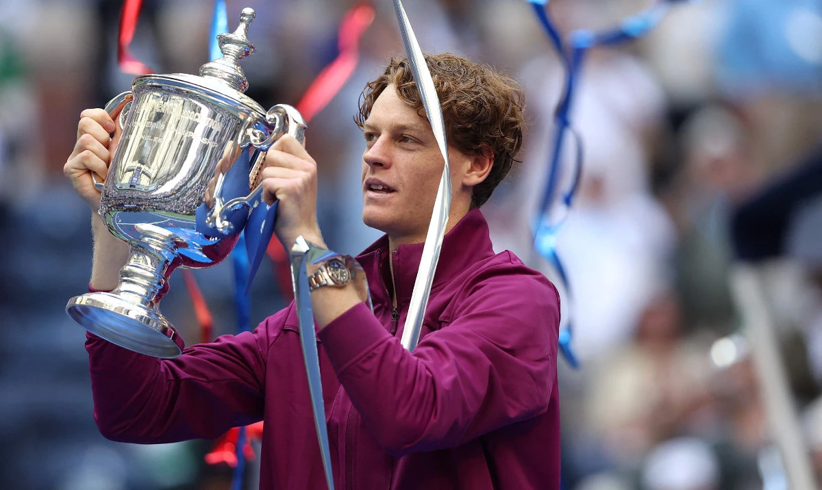 Jannik Sinner of Italy celebrates with the winners trophy after defeating Taylor Fritz of the United States to win the Men's Singles Final on Day Fourteen of the 2024 US Open at USTA Billie Jean King National Tennis Center on September 08, 2024 in the Flushing neighborhood of the Queens borough of New York City. (AFP)