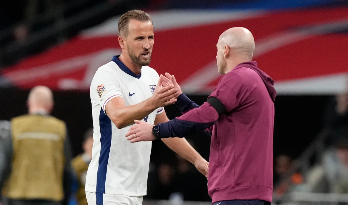 England's Harry Kane, left, is congratulated by England interim manager Lee Carsley after scoring his side's second goal during the Group F UEFA Nations League soccer match between England and Finland at Wembley Stadium in London Tuesday. (AP)