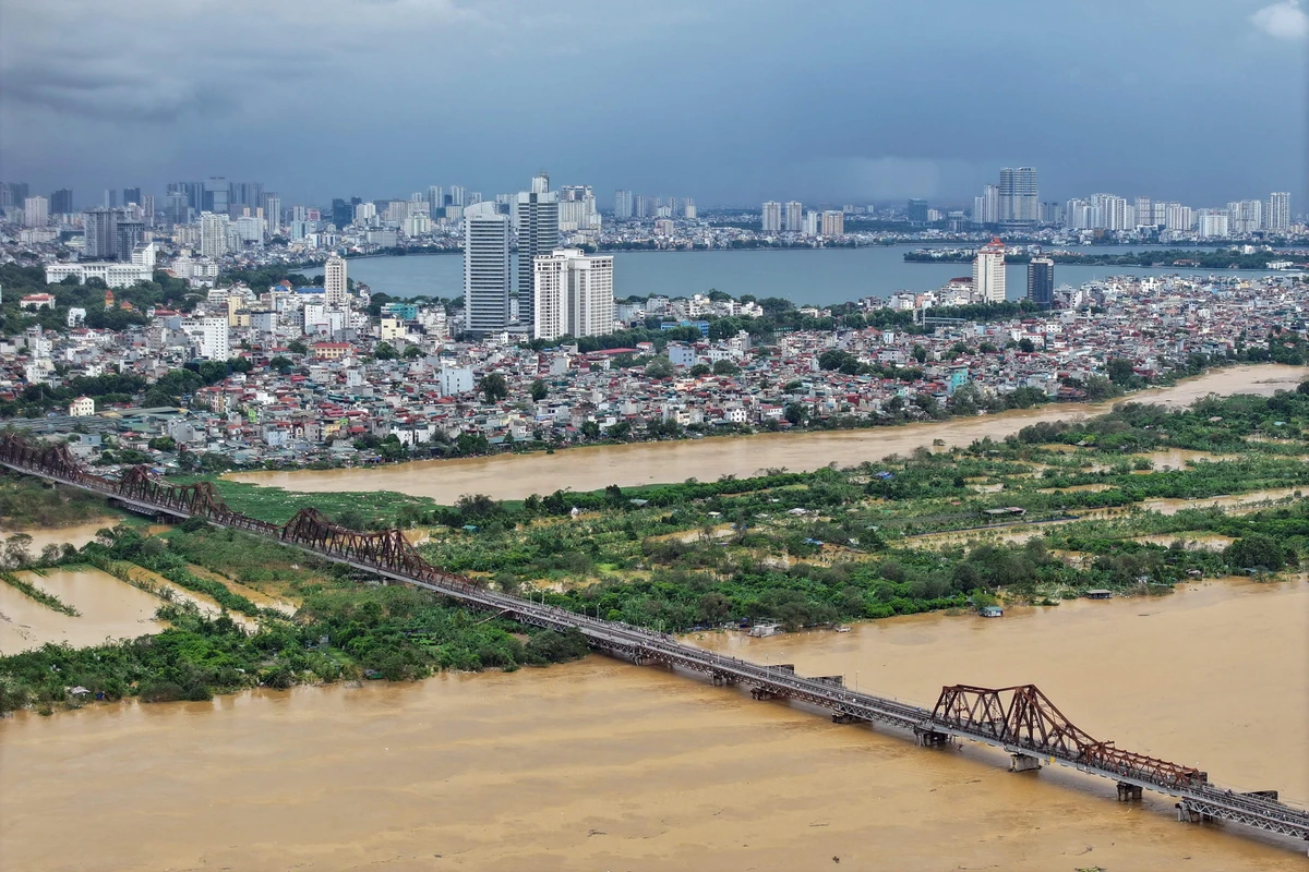 Above, the flooded Red River in Hanoi on Sept. 10, 2024 in the aftermath of Typhoon Yagi hitting northern Vietnam. (AFP)